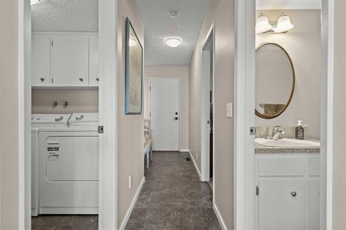 15 Beacham Rise Nw, Calgary, AB - Indoor Photo Showing Laundry Room