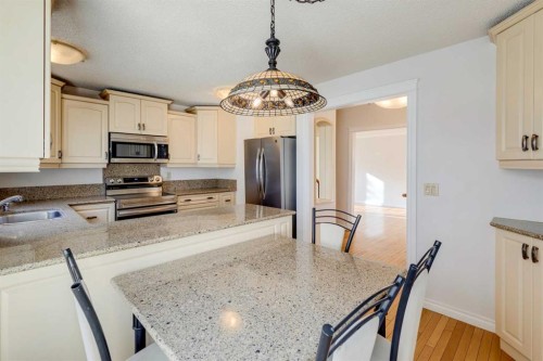 203 Edgeland Road Nw, Calgary, AB - Indoor Photo Showing Kitchen With Stainless Steel Kitchen