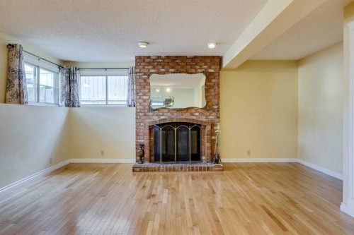 203 Edgeland Road Nw, Calgary, AB - Indoor With Fireplace