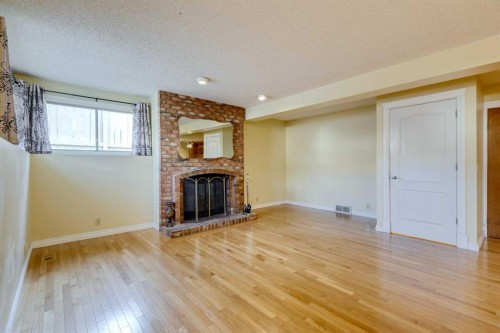 203 Edgeland Road Nw, Calgary, AB - Indoor With Fireplace