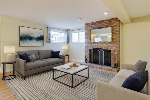 203 Edgeland Road Nw, Calgary, AB - Indoor Photo Showing Living Room With Fireplace