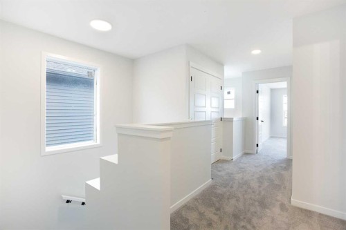 49 Creekside Passage Sw, Calgary, AB - Indoor Photo Showing Other Room