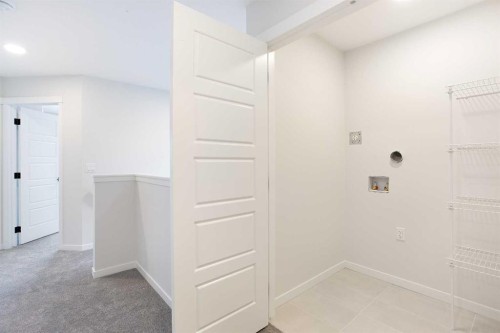 49 Creekside Passage Sw, Calgary, AB - Indoor Photo Showing Other Room