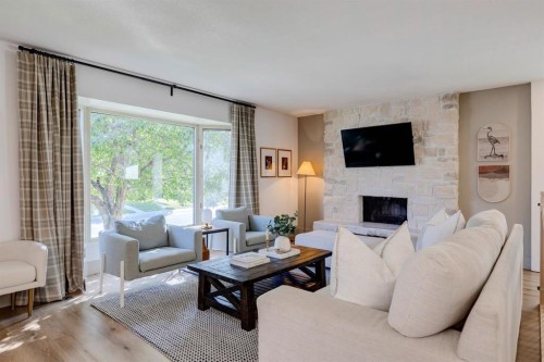 840 Archwood Road Se, Calgary, AB - Indoor Photo Showing Living Room With Fireplace