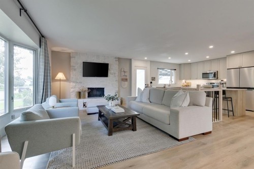840 Archwood Road Se, Calgary, AB - Indoor Photo Showing Living Room With Fireplace