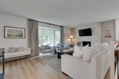 840 Archwood Road Se, Calgary, AB - Indoor Photo Showing Living Room With Fireplace