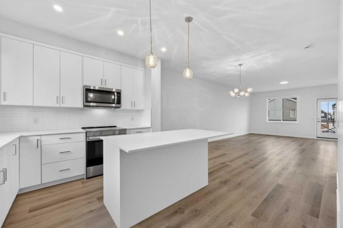 107-1750 Rangeview Drive Se, Calgary, AB - Indoor Photo Showing Kitchen With Upgraded Kitchen