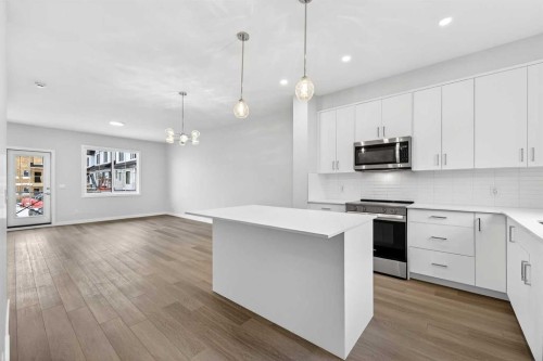 412-1750 Rangeview Drive Se, Calgary, AB - Indoor Photo Showing Kitchen With Upgraded Kitchen