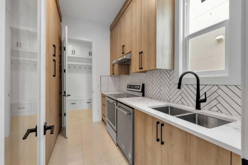 223 Kinniburgh Loop, Chestermere, AB - Indoor Photo Showing Kitchen With Double Sink With Upgraded Kitchen