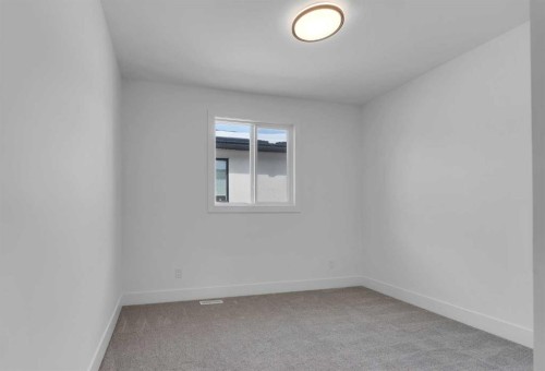 223 Kinniburgh Loop, Chestermere, AB - Indoor Photo Showing Other Room