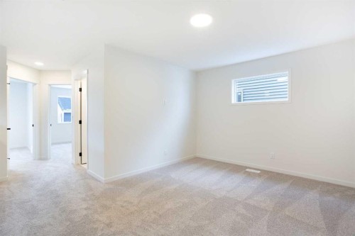 65 Creekside Passage Sw, Calgary, AB - Indoor Photo Showing Other Room
