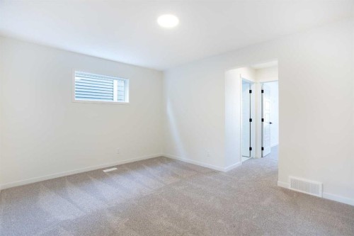 65 Creekside Passage Sw, Calgary, AB - Indoor Photo Showing Other Room