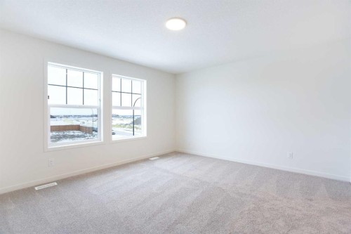65 Creekside Passage Sw, Calgary, AB - Indoor Photo Showing Other Room
