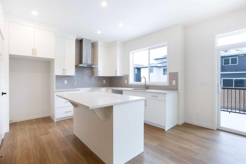 65 Creekside Passage Sw, Calgary, AB - Indoor Photo Showing Kitchen With Upgraded Kitchen