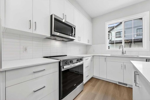 414-1750 Rangeview Drive Se, Calgary, AB - Indoor Photo Showing Kitchen With Upgraded Kitchen