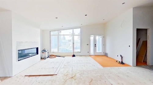 5616 Lodge Crescent Sw, Calgary, AB - Indoor Photo Showing Other Room With Fireplace