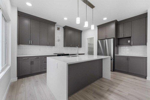 142 Sunstone Way, Balzac, AB - Indoor Photo Showing Kitchen With Upgraded Kitchen