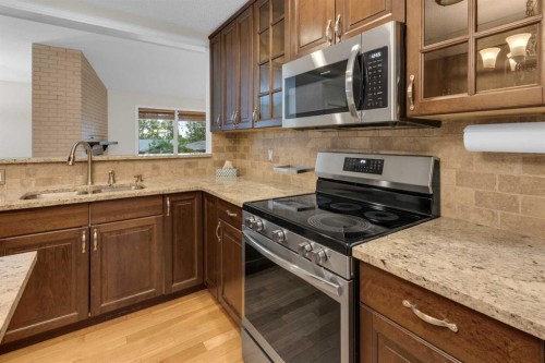 119 Cantrell Place Sw, Calgary, AB - Indoor Photo Showing Kitchen With Double Sink