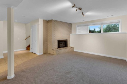 119 Cantrell Place Sw, Calgary, AB - Indoor With Fireplace