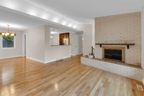 119 Cantrell Place Sw, Calgary, AB - Indoor Photo Showing Living Room With Fireplace