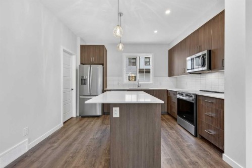 416-1750 Rangeview Drive Se, Calgary, AB - Indoor Photo Showing Kitchen With Upgraded Kitchen