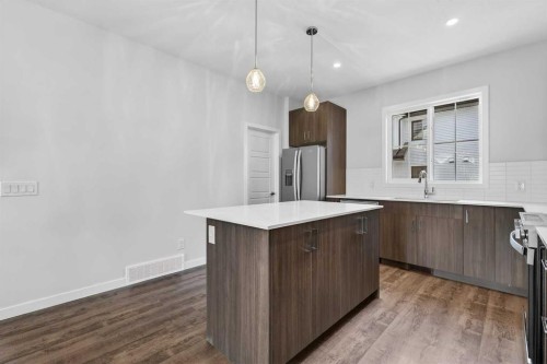 416-1750 Rangeview Drive Se, Calgary, AB - Indoor Photo Showing Kitchen With Upgraded Kitchen