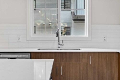 416-1750 Rangeview Drive Se, Calgary, AB - Indoor Photo Showing Kitchen With Double Sink