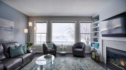 269 Boulder Creek Drive Se, Langdon, AB - Indoor Photo Showing Living Room With Fireplace