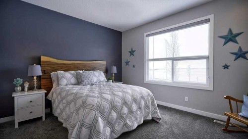 269 Boulder Creek Drive Se, Langdon, AB - Indoor Photo Showing Bedroom