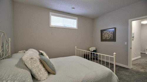 269 Boulder Creek Drive Se, Langdon, AB - Indoor Photo Showing Bedroom