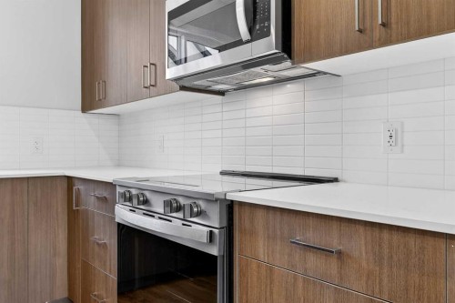 404-1750 Rangeview Drive Se, Calgary, AB - Indoor Photo Showing Kitchen With Upgraded Kitchen
