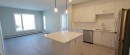 403-660 Shawnee Square Sw, Calgary, AB  - Indoor Photo Showing Kitchen With Double Sink 