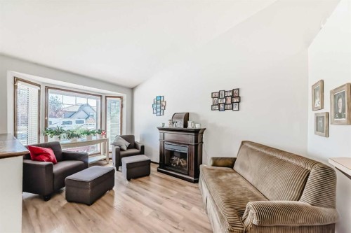 283 Highland Circle, Strathmore, AB - Indoor Photo Showing Living Room With Fireplace
