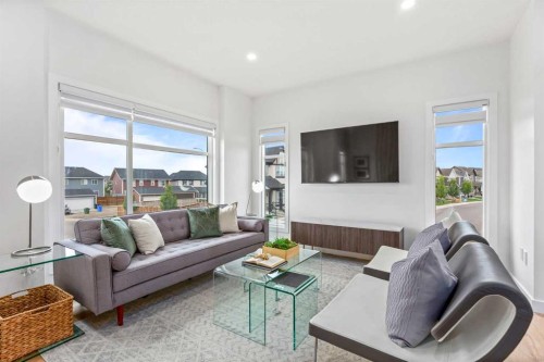 704-200 Belvedere Boulevard Se, Calgary, AB - Indoor Photo Showing Living Room