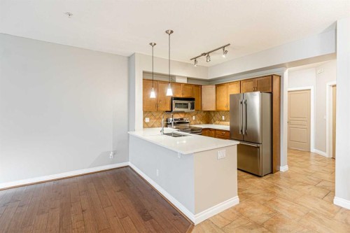 3-148 Rockyledge View Nw, Calgary, AB - Indoor Photo Showing Kitchen With Stainless Steel Kitchen