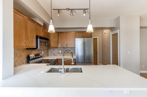 3-148 Rockyledge View Nw, Calgary, AB - Indoor Photo Showing Kitchen With Stainless Steel Kitchen
