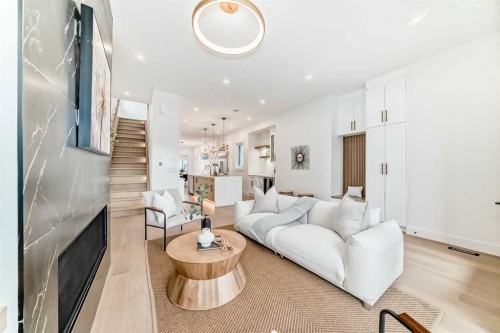214 27 Avenue Nw, Calgary, AB - Indoor Photo Showing Living Room With Fireplace