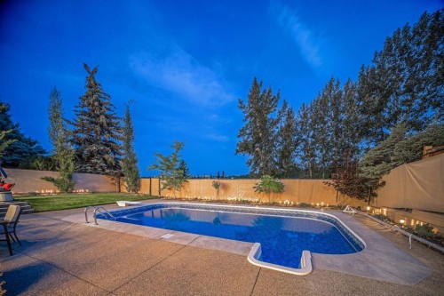42 Woodhaven Crescent Sw, Calgary, AB - Outdoor With In Ground Pool With Backyard