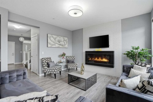 58 Howse Mount Ne, Calgary, AB - Indoor Photo Showing Living Room With Fireplace