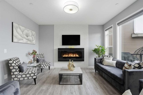 58 Howse Mount Ne, Calgary, AB - Indoor Photo Showing Living Room With Fireplace