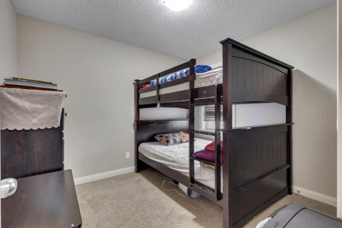1564 Copperfield Boulevard Se, Calgary, AB - Indoor Photo Showing Bedroom