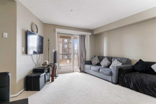 203-5 Saddlestone Way Ne, Calgary, AB - Indoor Photo Showing Living Room