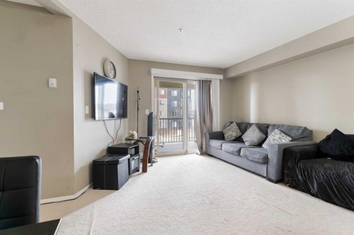 203-5 Saddlestone Way Ne, Calgary, AB - Indoor Photo Showing Living Room
