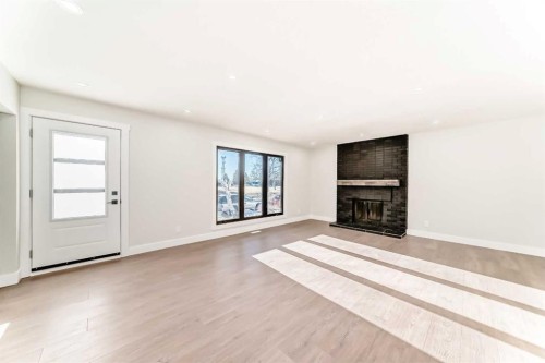 116 Rundlecairn Rise Ne, Calgary, AB - Indoor Photo Showing Living Room With Fireplace