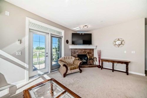 216-1005B Westmount Drive, Strathmore, AB - Indoor With Fireplace