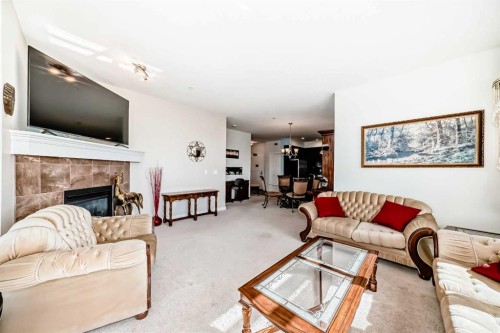 216-1005B Westmount Drive, Strathmore, AB - Indoor Photo Showing Living Room With Fireplace