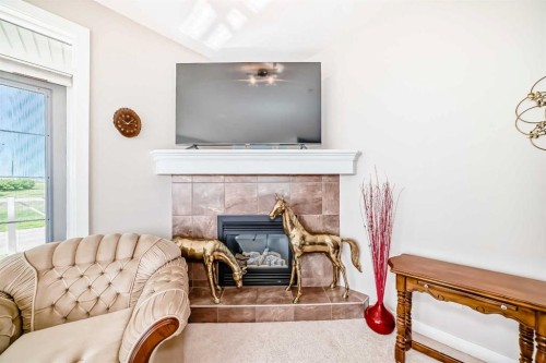 216-1005B Westmount Drive, Strathmore, AB - Indoor Photo Showing Living Room With Fireplace