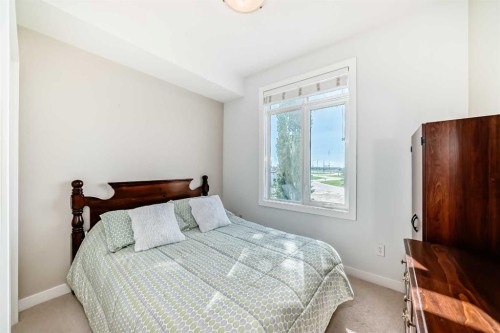 216-1005B Westmount Drive, Strathmore, AB - Indoor Photo Showing Bedroom