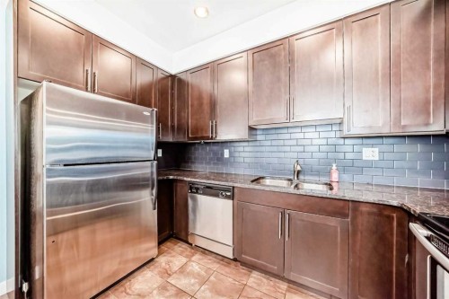216-1005B Westmount Drive, Strathmore, AB - Indoor Photo Showing Kitchen With Double Sink