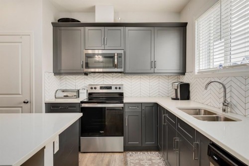 53 Seton Manor Se, Calgary, AB - Indoor Photo Showing Kitchen With Stainless Steel Kitchen With Double Sink With Upgraded Kitchen